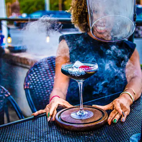 A smoking cocktail served on the patio