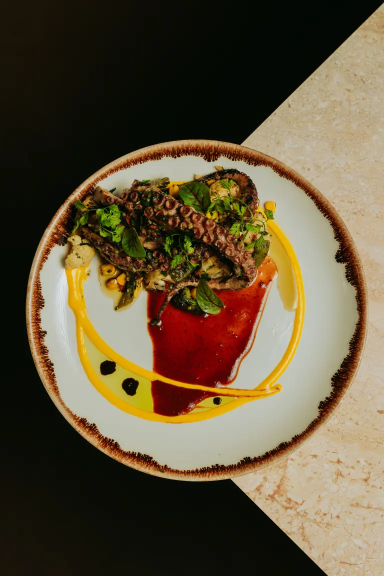 Grilled octopus with roasted corn and cauliflower