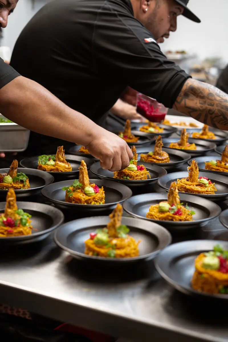 Plates being finished by hand on the pass